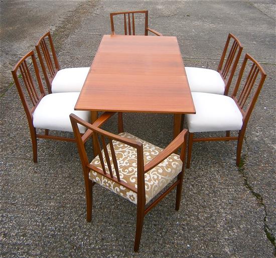 A Gordon Russell teak extending dining table and six chairs (4+2 carvers)